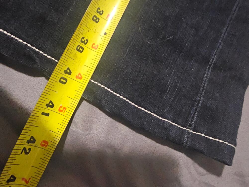 Dark wash denim jeans with contrast stitching faded whiskering